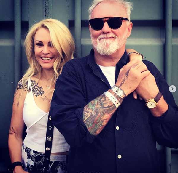 Sarina Taylor and Roger Taylor taking picture together.